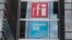 FILE - The headquarters of French national audiovisual media company group France Medias Monde (FMM), displays signage for Radio France Internationale (RFI) and France 24, in Issy-les-Moulineaux, near Paris, April 9, 2019.