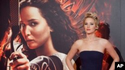 Jennifer Lawrence saat pemutaran pertama film "The Hunger Games: Catching Fire" di Callao Cinema, Madrid, Spanyol, 13 November 2013. (AP Photo/Abraham Caro Marin)
