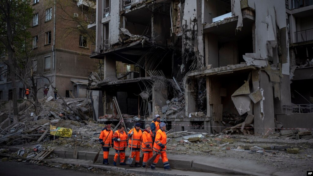 Clean-up crews prepare to work at the site of an explosion in Kyiv, Ukraine on April 29, 2022. Russia struck the Ukrainian capital of Kyiv shortly after a meeting between President Volodymyr Zelenskyy and U.N. Secretary-General António Guterres on Thursda