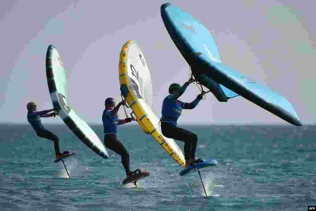 Competitors take part in one of the events of the first and only French stage of the GWA Wingfoil World Cup during the 25th edition of the 'Mondial du Vent' event in Leucate, southern France