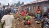 FILE - Refugees from the Democratic Republic of Congo are seen at makeshift shelters in Kisoro, Uganda, March 31, 2022.