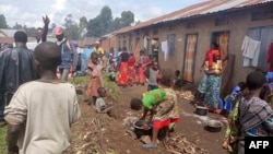 FILE - Refugees from the Democratic Republic of Congo are seen at makeshift shelters in Kisoro, Uganda, March 31, 2022.