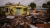 Debris from homes destroyed by Hurricane Milton lies strewn around still-standing houses on Manasota Key, Fla., Oct. 12, 2024.