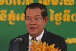 FILE - Cambodian Prime Minister Hun Sen delivers a speech at Phnom Penh International Airport, in Phnom Penh, Cambodia, Feb. 7, 2021.