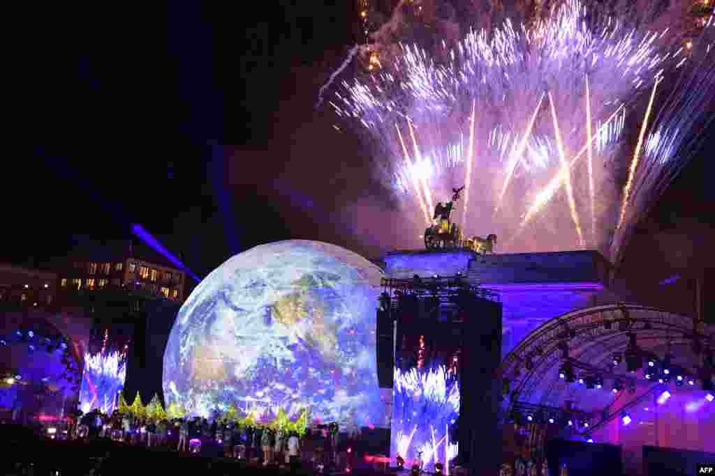 Fireworks are seen during the public show for the 30th anniversary of the fall of the Berlin Wall, Nov. 9, 2019 at the Brandenburg Gate (Brandenburger Tor) in Berlin, Germany.
