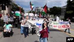 FILE - Pro-Palestinian demonstrators protest in support of the Palestinians who have died in Gaza outside of the Arab American National Museum in Dearborn, Michigan, on Aug. 11, 2024.