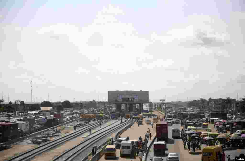 A general view of the traffic beside a light rail project under construction along Mile 2 in Lagos.