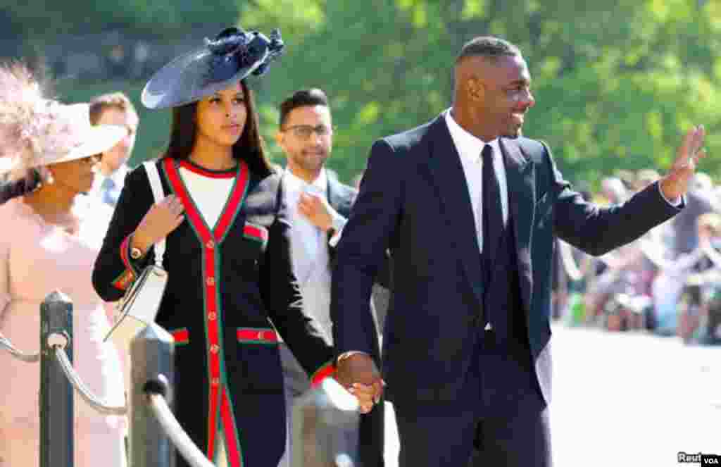 Idris Elba na Sabrina Dhowre wakiwasili katika Kanisa la Mtakatifu George&#39;s, katika Kasri ya Windsor kuhudhuria ndoa ya Meghan Markle and Prince Harry Mei 19, 2018.