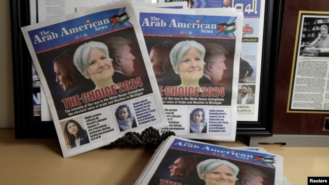 FILE - The front cover of the Arab American News with the lead story on the electoral voice of Arabs and Muslims in Michigan is seen in the newspaper's office in Dearborn, Michigan, Sept. 18, 2024.