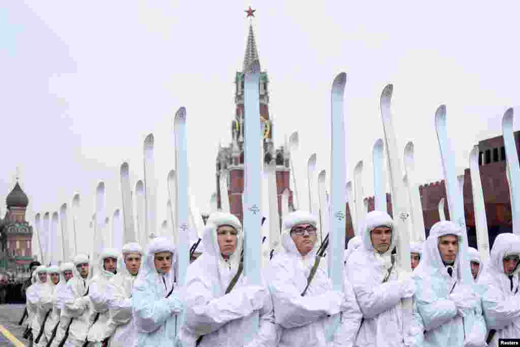 Russian servicemen dressed in historical uniforms rehearse for a forthcoming parade on Red Square in Moscow.