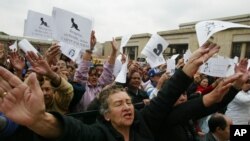 FILE - A woman shouts slogans against abortion during a protest at Bolivar's square, Bogota, Colombia. 