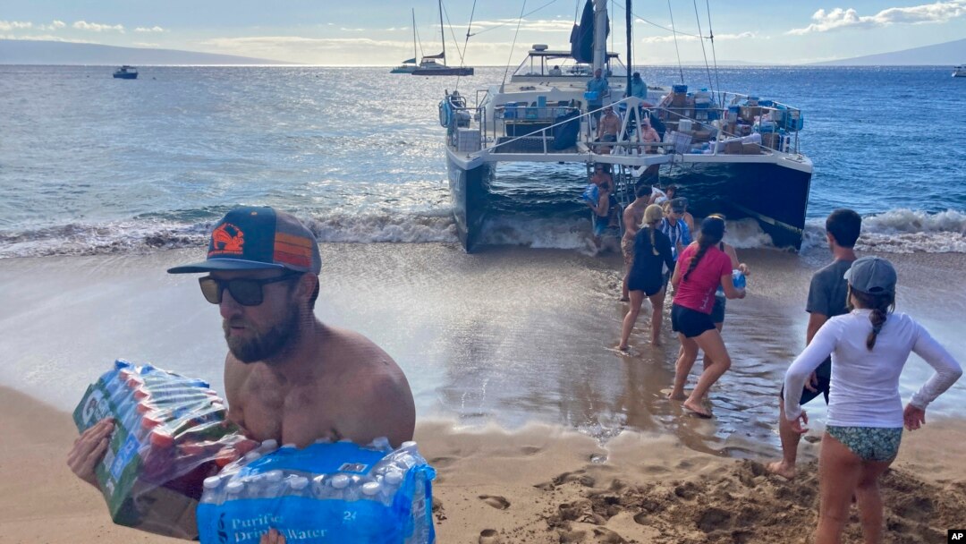 Volunteers who sailed from Maalaea Bay, Maui, form an assembly line on Kaanapali Beach on Aug. 12, 2023, to unload donations. The Maui fire damaged water pipes, resulting in a loss of pressure that likely allowed toxic chemicals along with metals and bacteria into water lines. 
