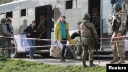 Azovstal steel plant employee Natalia Usmanova, 37, who was evacuated from Mariupol, arrives at a temporary accommodation centre during Ukraine-Russia conflict in the village of Bezimenne in the Donetsk Region, May 1, 2022. 