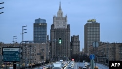 FILE - Traffic moves in front of Russian Foreign Ministry headquarters in Moscow, Russia, April 25, 2022.