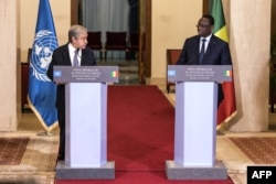 United Nations Secretary-General Antonio Guterres, left, and Senegal's President Macky Sall hold a press conference during the U.N. chief's West Africa tour, in Dakar, May 1, 2022.