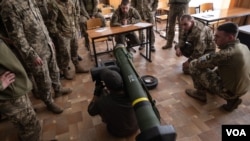 A US volunteer teaches Ukrainian soldiers how to use a Javelin anti-tank missile, April 28, 2022, in Ukraine's Zaporizhzhia region.