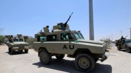 FILE - Burundian African Union peacekeepers in Somalia travel in an armored vehicle as they leave the Jaale Siad Military academy, in Mogadishu, Somalia, Feb. 28, 2019. An attack by al-Shabab militants May 3, 2022, left at least 30 Burundian soldiers dead.