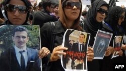 FILE - Relatives and friends of Kurdish journalist and student Sardasht Osman, who was kidnapped and killed last week, protest in front of the Kurdish parliament in the northern Iraqi city of Irbil, May 10, 2010, to demand an investigation into his assassination.