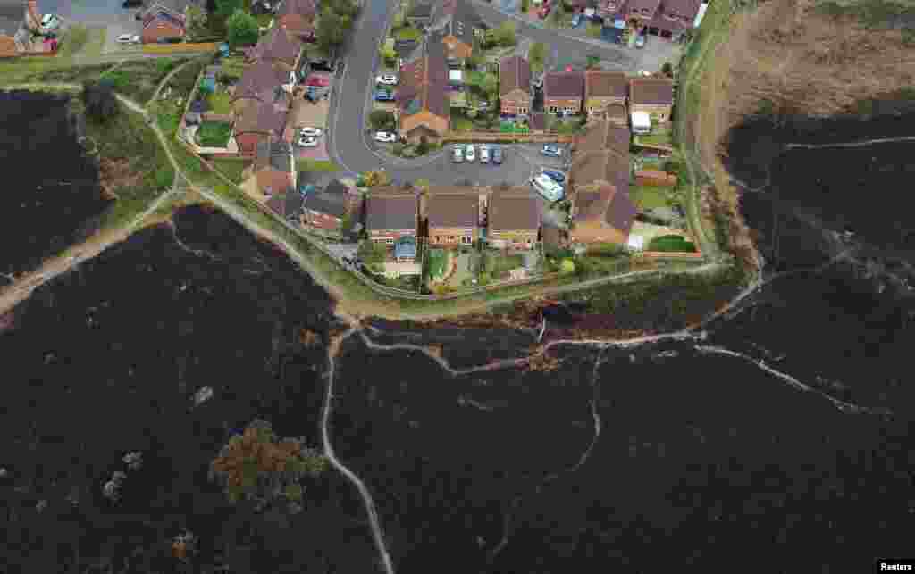 Scorched land is seen from above after a heath fire at Canford Heath in Poole, Britain, May 3, 2022.