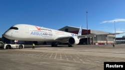 An Airbus A350-1000 test plane arrives at Sydney Airport as Qantas announces an order for 12 of the planes in Sydney, Australia, May 2, 2022. 