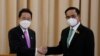 Japanese Prime Minister Fumio Kishida, left, shakes hands with Thailand's Prime Minister Prayuth Chan-ocha after a joint press conference at the government house in Bangkok, Thailand, Monday, May 2, 2022. (AP Photo/Sakchai Lalit)