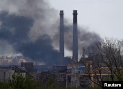 Smoke rises above a plant of Azovstal Iron and Steel Works during the Ukraine-Russia conflict in the southern port city of Mariupol, Ukraine, May 2, 2022.