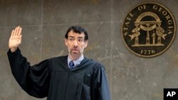 Fulton County Superior Court Judge Robert McBurney swears in potential jurors during proceedings to seat a special purpose grand jury in Fulton County, Georgia, May 2, 2022.