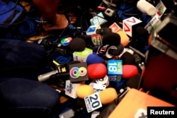 Media microphones are seen during a press conference led by the Palang Pracharat Party in Bangkok, Thailand June 4, 2019. REUTERS