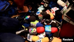 Media microphones are seen during a press conference led by the Palang Pracharat Party in Bangkok, Thailand June 4, 2019. REUTERS