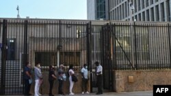 FILE - People queue at the US embassy in Havana, Cuba on May 3, 2022, as the consulate resumed issuing some immigrant visa services.