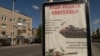 A sign instructs Ukrainians to "put Molotov cocktails here" pointing to sensitives spots on Russian tanks on April 27, 2022 in Zaporizhzhya, Ukraine. (Yan Boechat/VOA)