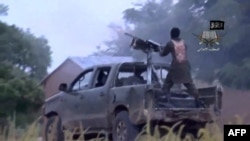 FILE - A screengrab taken Aug. 24, 2014, from a video released by the Nigerian Islamist extremist group Boko Haram and obtained by AFP shows alleged members of the group during fighting at an undisclosed location.