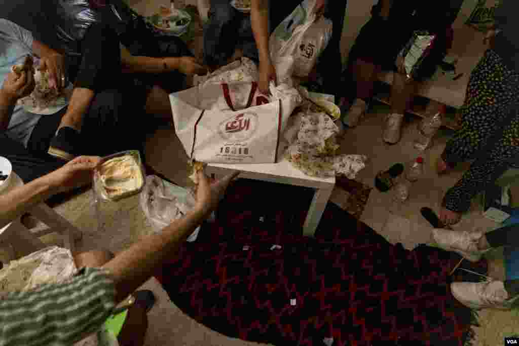 Bars usually reopen on the last night of Ramadan, but were instead allowed to welcome back customers on the first day of Eid al-Fitr this year, leaving friends to gather at home, downtown Cairo, May 1, 2022. (Hamada Elrasam/VOA)