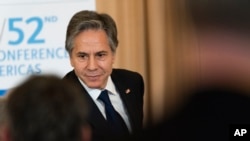 Secretary of State Antony Blinken greets attendees at the annual Conference on the Americas luncheon at the State Department, May 3, 2022, in Washington. 