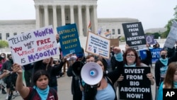 Demonstrators protest outside of the U.S. Supreme Court, May 3, 2022 in Washington. (AP Photo/Jose Luis Magana)
