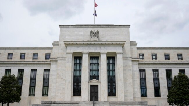 FILE - This May 4, 2021, file photo shows the Federal Reserve building in Washington.