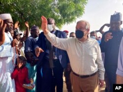 United Nations Secretary-General Antonio Guterres waves to the crowds upon arrival in Maiduguri, Nigeria, May 3, 2021.