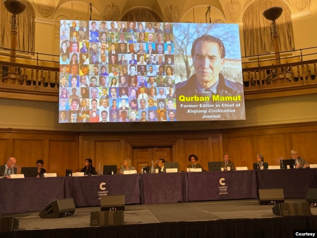 A testimonial slideshow of Bahram Sintash is displayed on the screen of the Uyghur Tribunal, in London, 2021. (Photo courtesy of Bahram Sintash)