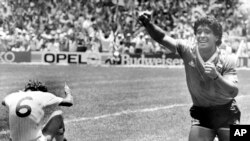 FILE - Argentina's Diego Maradona celebrates his second goal against England in the World Cup quarterfinal, in Mexico City, Mexico, June 22, 1986.