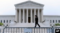 The U.S. Supreme Court is seen early Tuesday, May 3, 2022 in Washington.