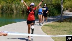 Jacky Hunt-Broersma finishes her 102nd marathon in 102 days, this one at Veterans Oasis Park, in Chandler, Arizona, April 28, 2022.