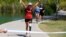 Jacky Hunt-Broersma finishes her 102nd marathon in 102 days, this one at Veterans Oasis Park, in Chandler, Arizona, April 28, 2022.