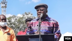 Tendai Biti of the Citizens Coalition for Change addressing people at a Workers Day event in Harare on Sunday.