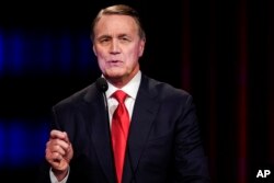 FILE - Former Sen. David Perdue speaks in Atlanta, Ga., May 1, 2022.