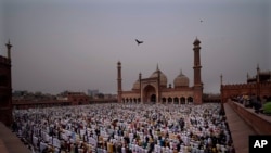 FILE - Muslims offer Eid al-Fitr prayers at the Jama Masjid in New Delhi, India, May 3, 2022.