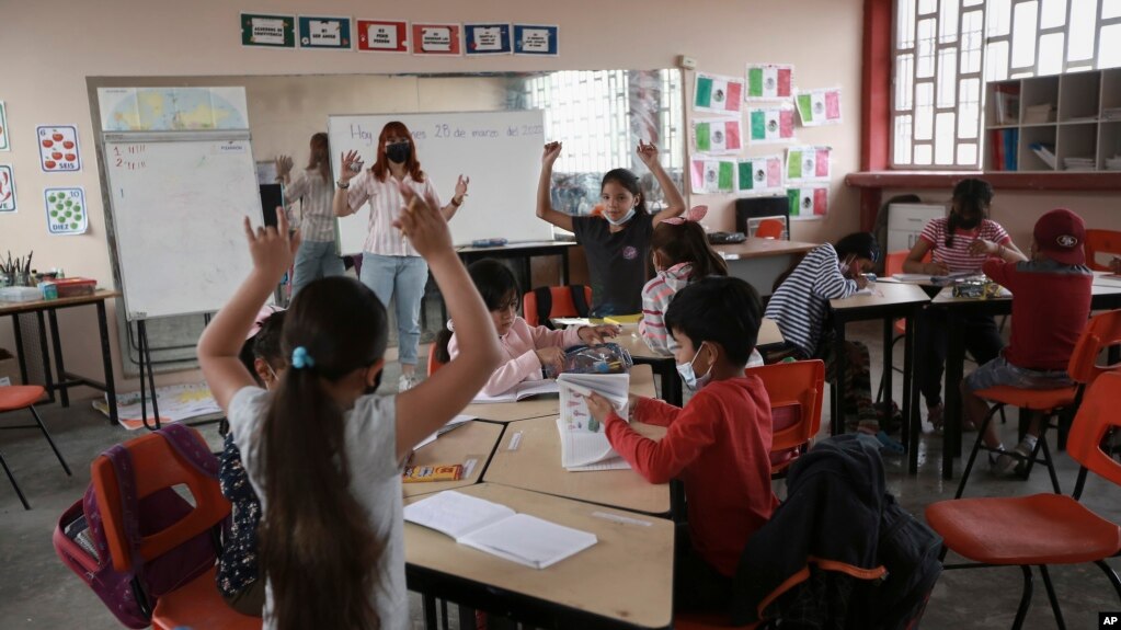 Migrant children participate in a classroom activity at Casa Kolping, an alternative education center. (AP Photo/Christian Chavez)