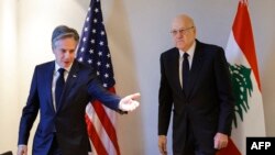 U.S. Secretary of State Antony Blinken gestures towards Lebanon's caretaker prime minister Najib Mikati during a day of meetings amid the ongoing conflict between Israel and Hamas, in the Jordanian capital Amman on November 4, 2023. (Photo by JONATHAN ERNST / POOL / AFP)