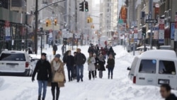 Snow along Broadway in New York City on December 27 after a blizzard dropped up to 74 centimeters of snow in the northeastern United States. The storm limited travel at the end of the busy Christmas weekend.