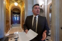 FILE - Sen. Cory Gardner, R-Colo., arrives at the Senate Chamber at the Capitol in Washington, Dec. 31, 2018.
