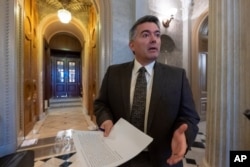FILE - Sen. Cory Gardner, R-Colo., arrives at the Senate Chamber at the Capitol in Washington, Dec. 31, 2018.